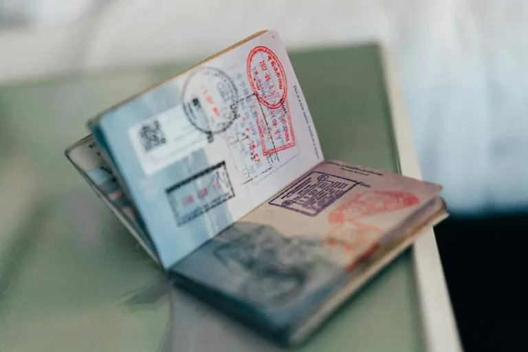 Open passport showing multiple entry and exit stamps for international travel