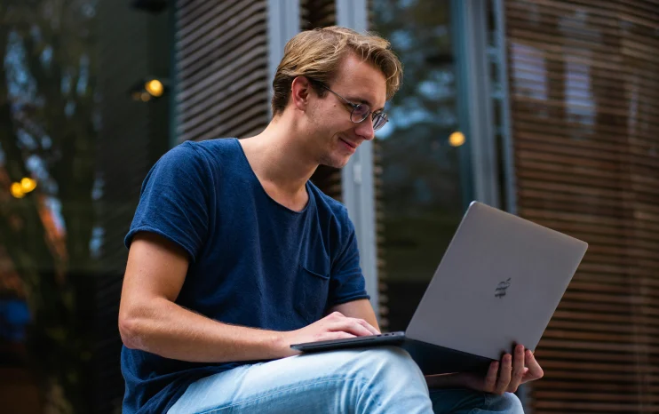 Digital professional working remotely, illustrating lifestyle benefits of Thailand Long-Term Resident Visa